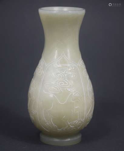 A CARVED HETIAN JADE VASE