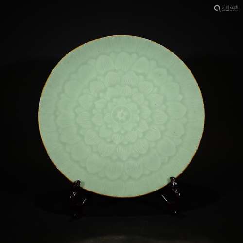 QING D., A PEA-GREEN GLAZED SAUCER