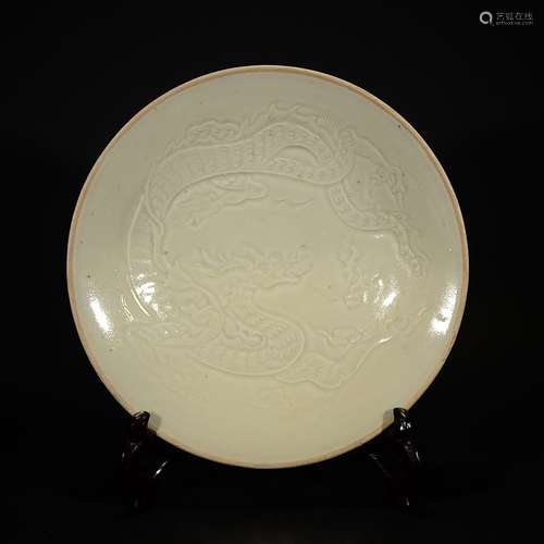 A DING WARE FLORAL DISH WITH DRAGON PATTERN