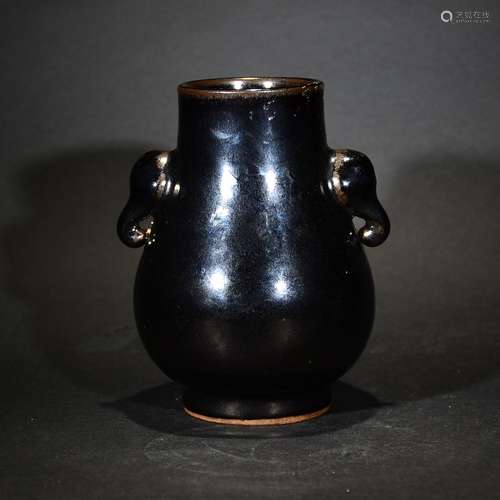 A BLACK GLAZED VASE