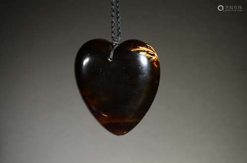 A BLUE AMBER HEART SHAPE PENDANT