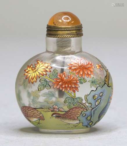 AN ENAMELLED PEKING GLASS SNUFF BOTTLE