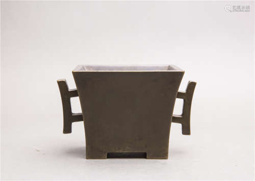 A BRONZE CENSER WITH TWO HANDLES