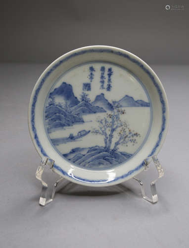 A BLUE AND WHITE PLATE