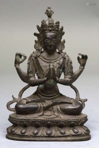 A BRONZE FIGURE OF FOUR-ARMED GUANYIN