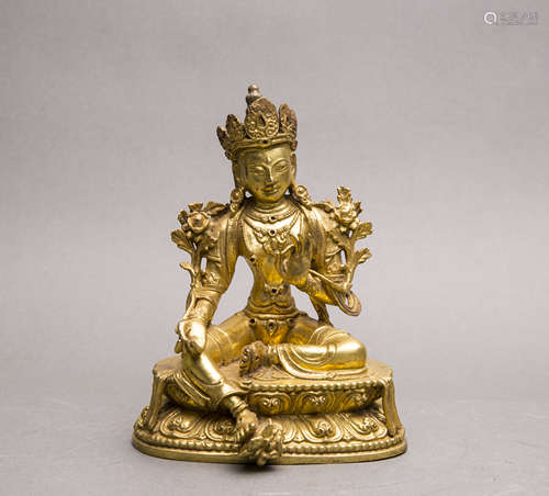 A GILT-BRONZE FIGURE OF TARA