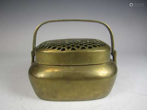 A CHINESE BRASS HAND WARMER