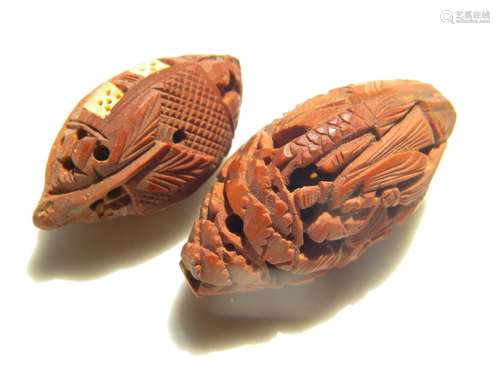 Pair of antique carved Nut Pit