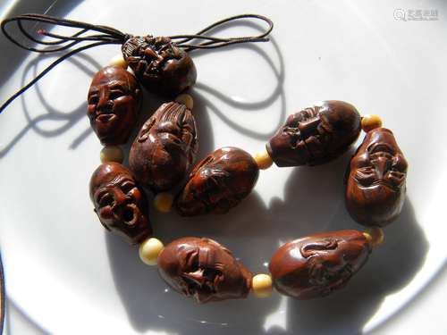 A String of Pit Nut Carved Beads