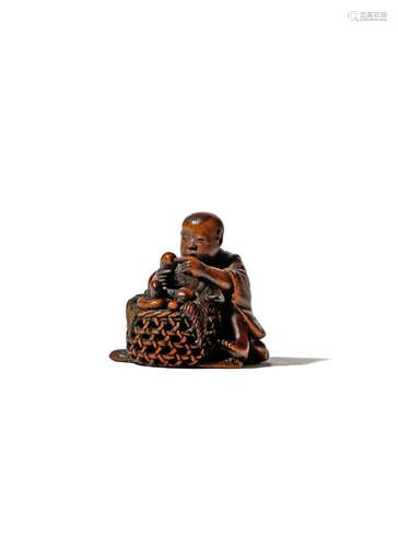 A JAPANESE WOOD NETSUKE