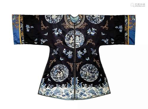 A CHINESE DARK BLUE SILK SURCOAT