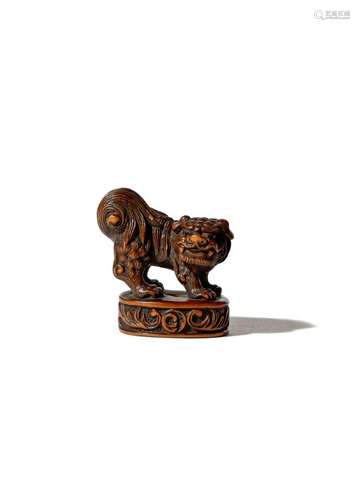 A JAPANESE WOOD NETSUKE