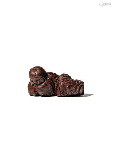 A JAPANESE WOOD NETSUKE