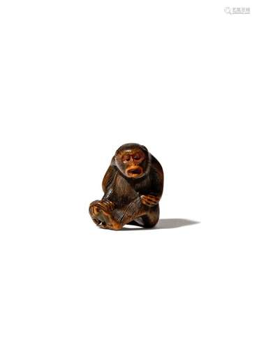 A JAPANESE WOOD NETSUKE