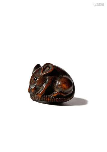 A JAPANESE WOOD NETSUKE