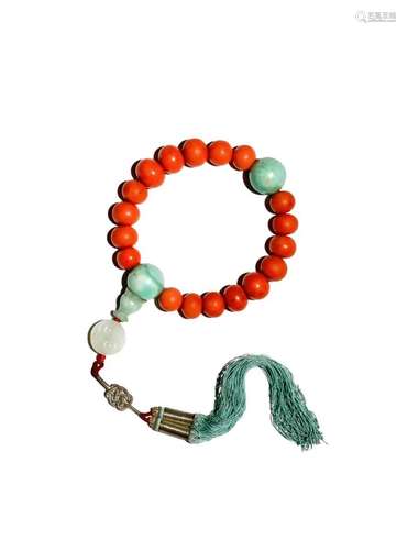 A CHINESE CORAL AND JADEITE ROSARY BRACELET