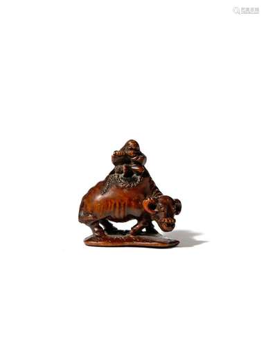 A JAPANESE WOOD NETSUKE