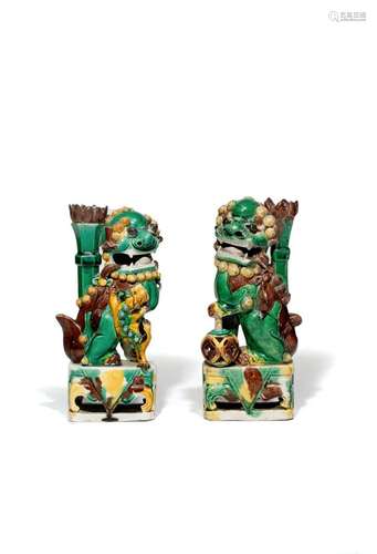 A MATCHED PAIR OF CHINESE FAMILLE VERTE MODELS OF BUDDHIST LION DOGS