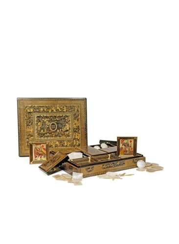A CHINESE BLACK AND GOLD LACQUER RECTANGULAR GAMES BOX