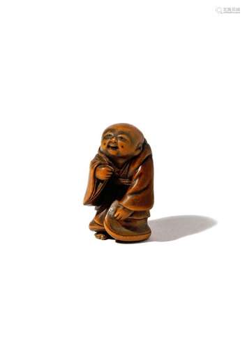 A JAPANESE WOOD NETSUKE