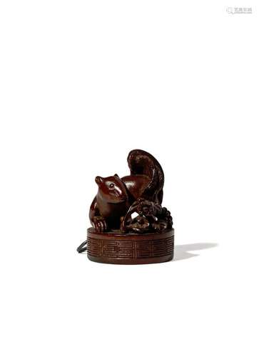 A JAPANESE WOOD NETSUKE