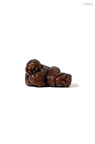 A JAPANESE WOOD NETSUKE