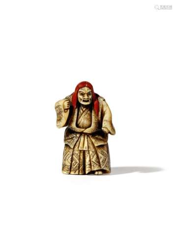 A JAPANESE LACQUER AND IVORY NETSUKE