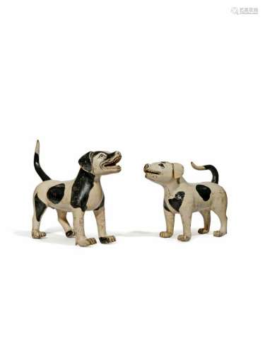 AN UNUSUAL PAIR OF CHINESE CARVED WOOD MODELS OF SPOTTED HOUNDS