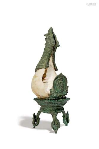 A KHMER BRONZE-MOUNTED BAYON-STYLE RITUAL CONCH SHELL