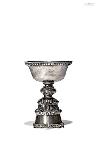 A TIBETAN SILVER STEM CUP OR BUTTER LAMP