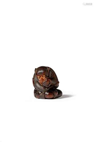 A JAPANESE WOOD NETSUKE