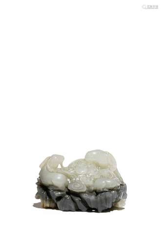 A CHINESE PALE CELADON JADE MODEL OF GOATS