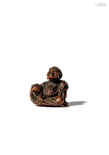 A JAPANESE WOOD NETSUKE