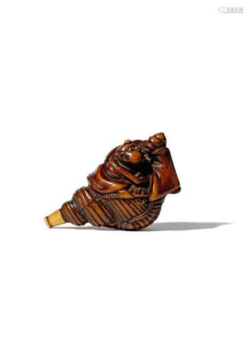 A JAPANESE WOOD AND IVORY NETSUKE