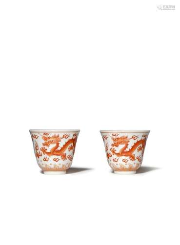 A PAIR OF CHINESE IRON-RED DRAGON WINE CUPS