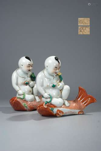 PAIR OF CHINESE FAMILLE ROSE PORCELAIN BOYS