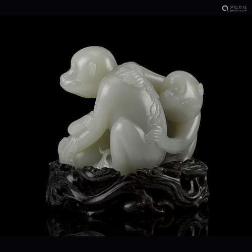 LARGE PALE CELADON JADE 'MONKEY AND PEACH' GROUP QIANLONG PERIOD