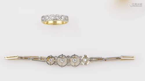 A gold and diamond bracelet and ring