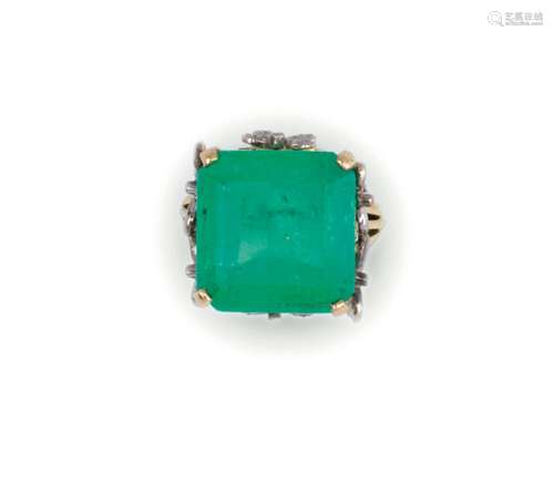 An emerald and diamond ring