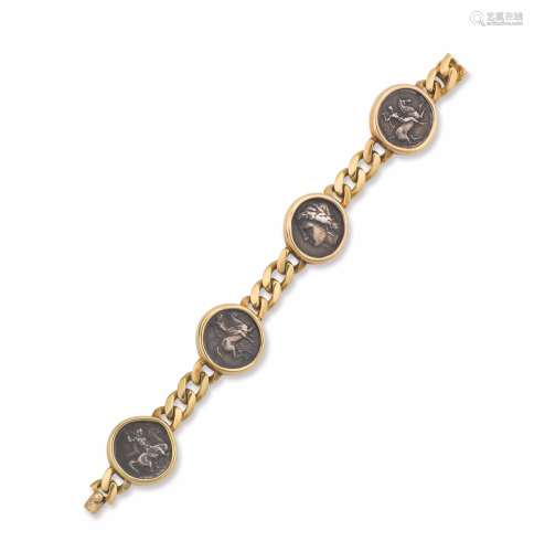 A gold bracelet with four coins. Bulgari