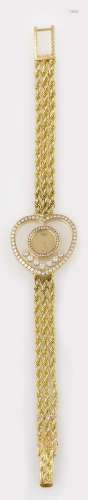 A gold and diamond wristwatch. Chopard