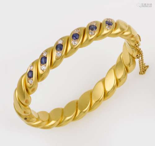 A gold, sapphire and diamond bangle