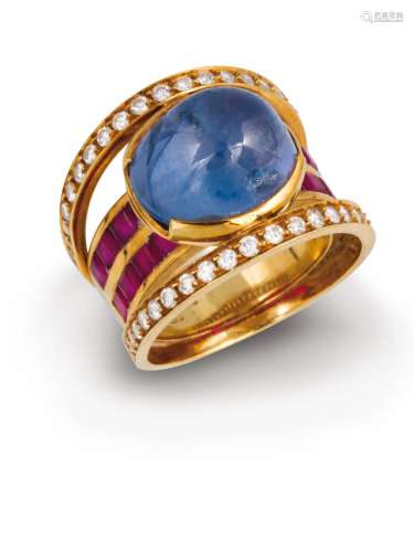 A cabochon - cut sapphire, diamond and ruby ring