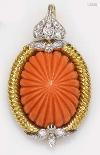 A carved coral, diamond and gold pendant