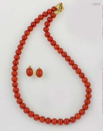 A coral necklace and a pair of coral earrings