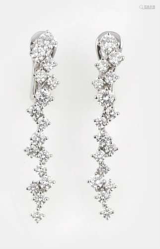 A pair of diamond and gold earrings. Brarda