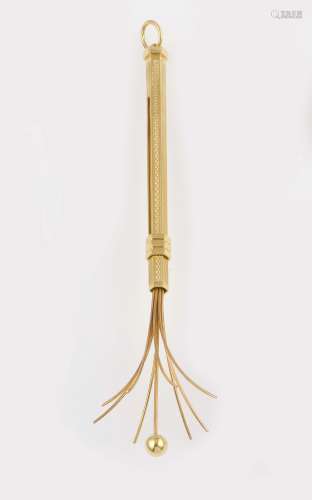 A gold champagne whisk