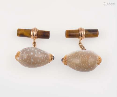 A pair of shell, tiger's eye and sapphire cufflinks