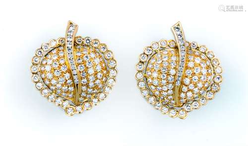 A pair of diamond and gold earrings