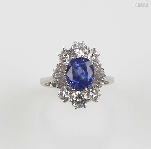 A sapphire and diamond ring. The Sri Lankan sapphire weighing 4,00 carats is set with diamonds and mounted in white gold 750/1000. Accompaigned with R.A.G. Torino gemological report